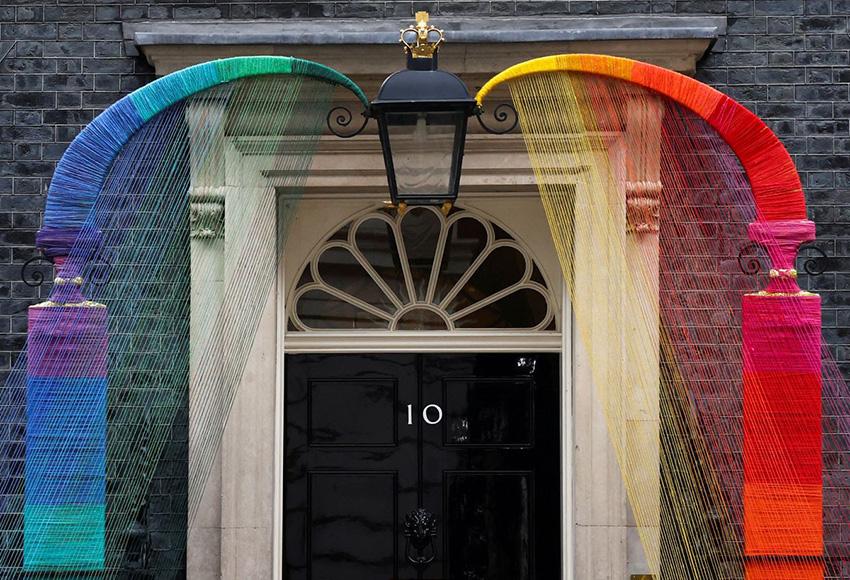 A rainbow arch installed at Number 10 Downing Street — Photo by Henry Nicholls / Reuters