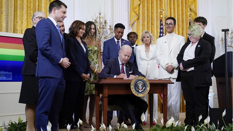 President Joe Biden signs an executive order at an event to celebrate Pride Month in the East Room of the White House, Wednesday, June 15, 2022, in Washington — Photo by Patrick Semansky / AP