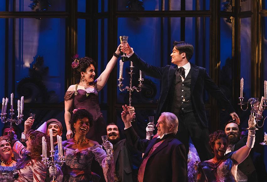 Mané Galoyan as Violetta (l), Duke Kim as Alfredo (r), and ensemble in La Traviata at Seattle Opera — Photo by Sunny Martini