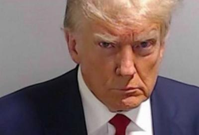 Donald Trump debuts new mug shot, continues to lead polls