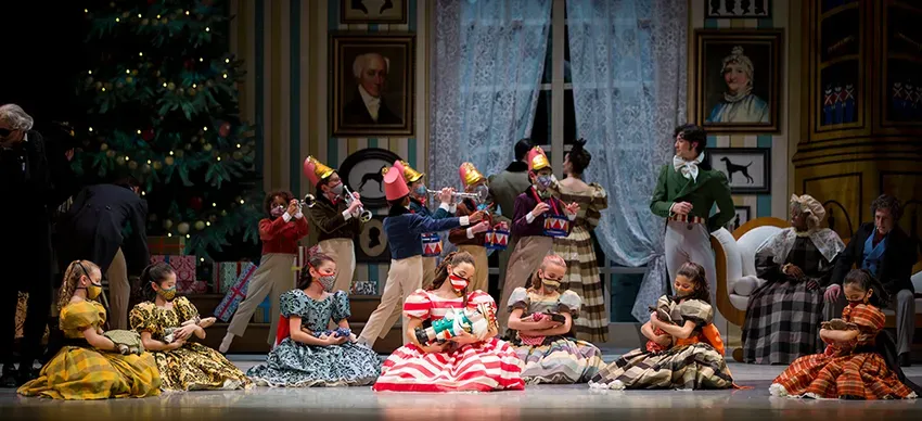 Annalise Dautricourt as Clara (center) with Pacific Northwest Ballet School students in the party scene from George Balanchine's The Nutcracker®, choreographed by George Balanchine © The George Balanchine Trust – Photo © Angela Sterling