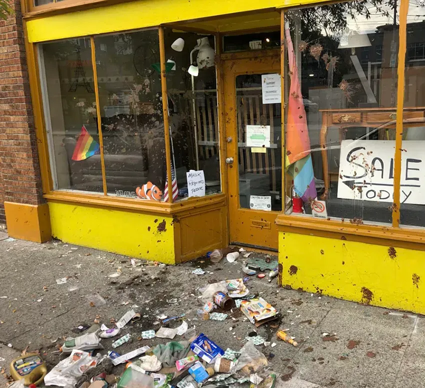 Used Furniture storefront after the most recent attack – Photo courtesy of John Morrison