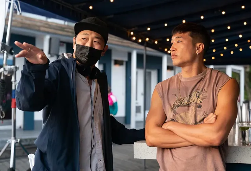 Director Andrew Ahn and writer-actor Joel Kim Booster on the set of Fire Island – Photo by Jeong Park / Searchlight Pictures
