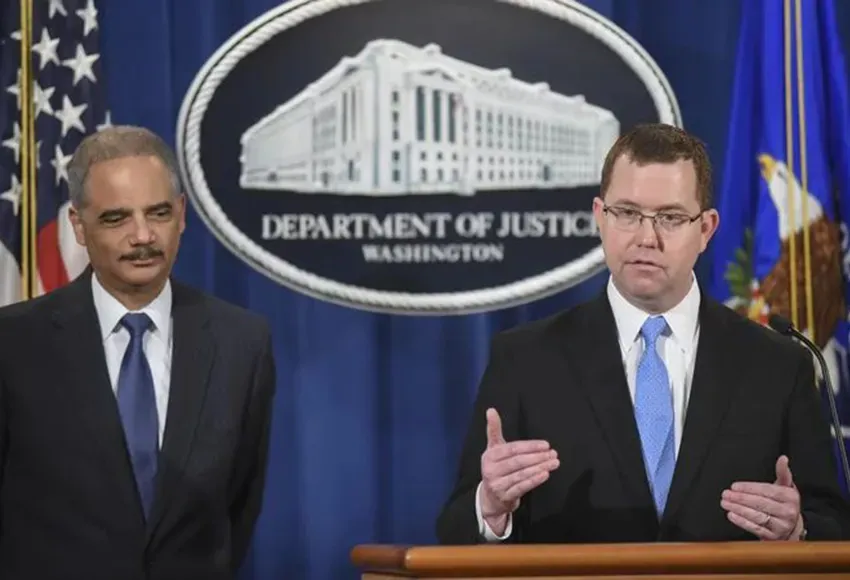 Stuart Delery (r) with Attorney General Eric Holder in 2015 – Photo by Kevin Wolf / AP