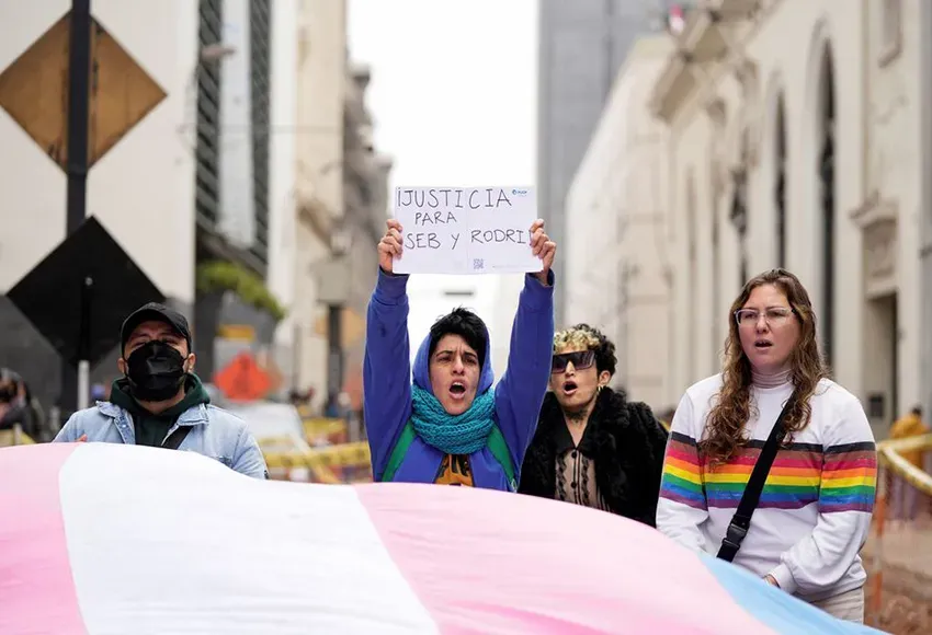 A demonstrator holds a sign reading 'Justice for Seb and Rodri' in Lima, Peru – Photo by Angela Ponce / Reuters