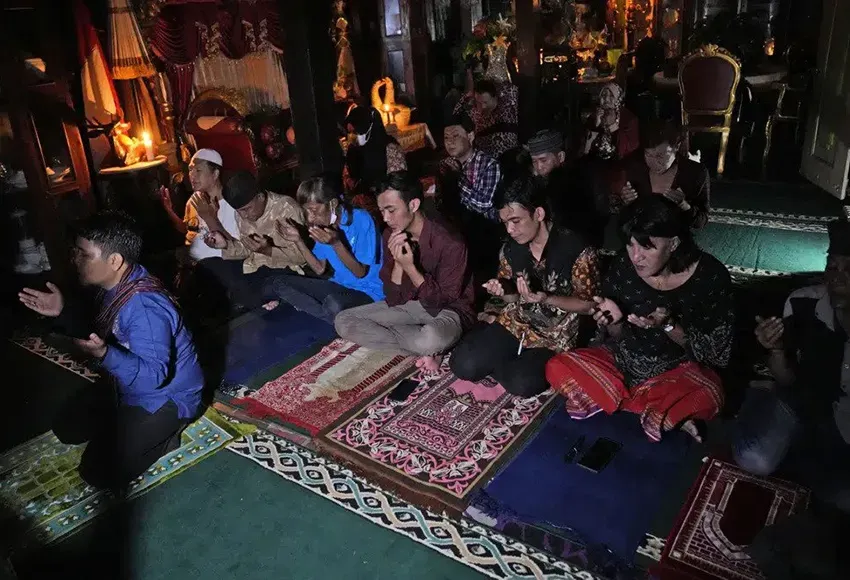 Trans women and activists in prayer at Al-Fatah Islamic School – Photo by Dita Alangkara / AP