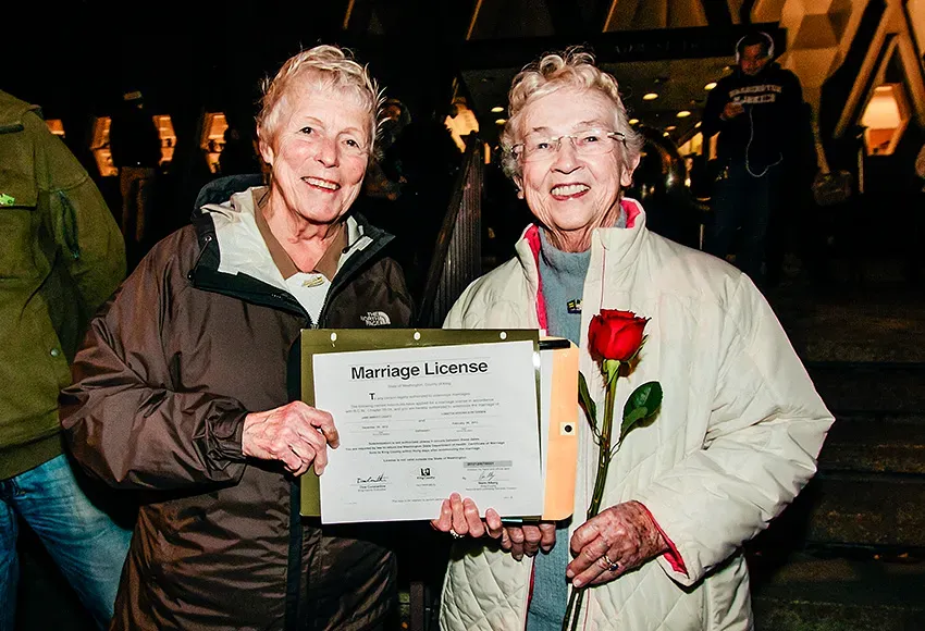 At midnight on Dec. 6, 2012, Jane Abbott Lightly, 77 and Pete-e Petersen, 85, became the first same-sex couple to receive a marriage license in King County, Washington – Photo by Nate Gowdy