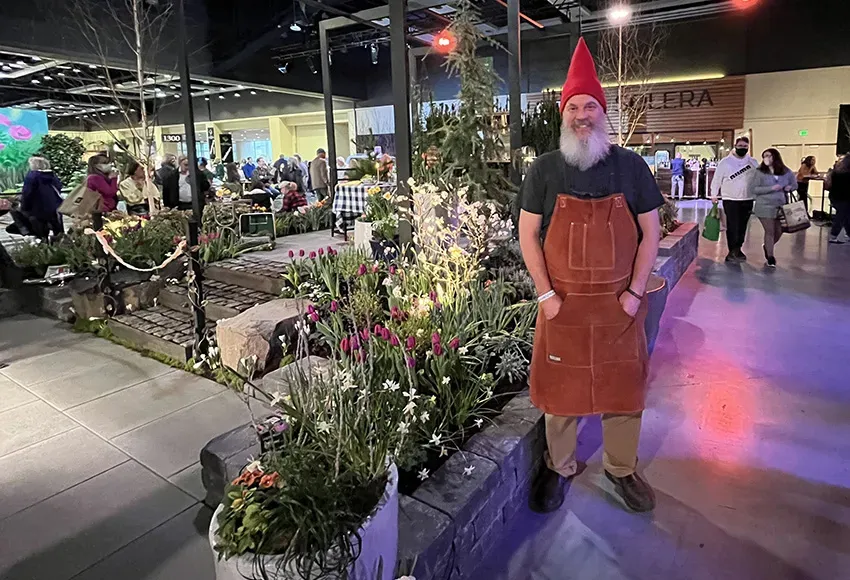 An attendee dressed as a garden gnome on the show floor – Photo by Daniel Lindsley