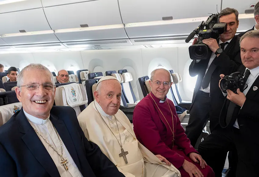 Rev. Iain Greenshields, moderator of the Presbyterian Church of Scotland, Pope Francis and Anglican Archbishop Justin Welby sit together aboard the flight from Juba, South Sudan, to Rome Feb. 5, 2023 – Photo courtesy Andrew O'Brien / Church of Scotland