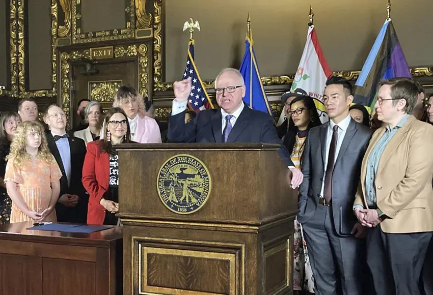 Minnesota Gov. Tim Walz speaks at a signing ceremony – Photo by Steve Karnowski / AP