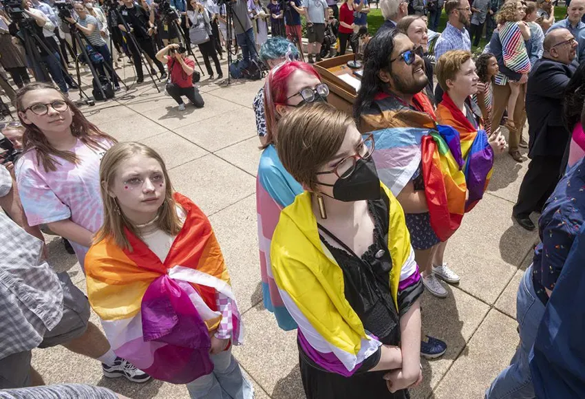 People watch the Rainbow Pride flag raising Wednesday, June 1, 2022 at the Capitol in Madison, Wis. – Photo by Mark Hoffman / Milwaukee Journal-Sentinel via AP