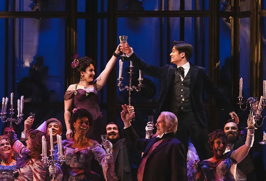 Mané Galoyan as Violetta (l), Duke Kim as Alfredo (r), and ensemble in La Traviata at Seattle Opera – Photo by Sunny Martini