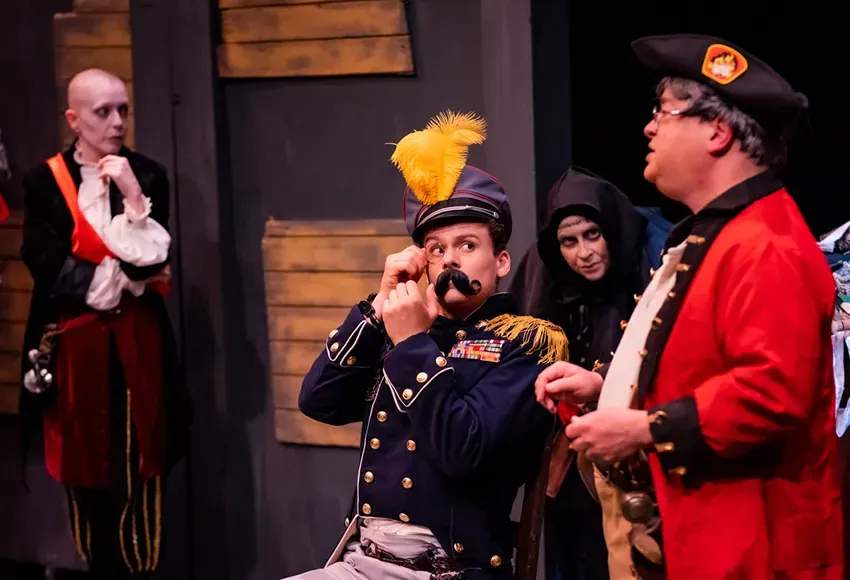 The evil Prince Heinrich (Rowan Gallagher, center) is captured by members of the Monstrous Regiment (Jacq Babb, Ali Kidder-Mostrom, Steven Sterne, l-r) – Photo by James Murphy, Trainman Photography