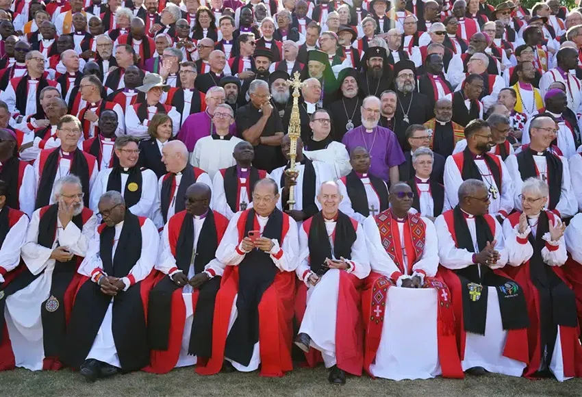 Archbishop of Canterbury Justin Welby, front row, center right poses for a photo with bishops from around the world at the University of Kent  – Photo by Gareth Fuller / PA via AP