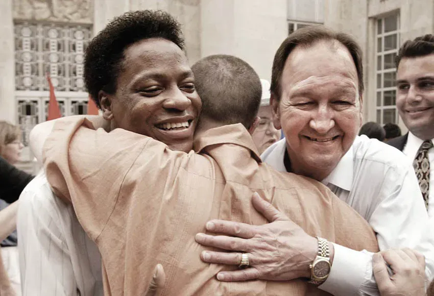 Tyron Garner (left) and John Geddes Lawrence (right) celebrate their Supreme Court win in the landmark Lawrence v. Texas case in Houston, 2003 – Photo by Erich Schlegel / AP