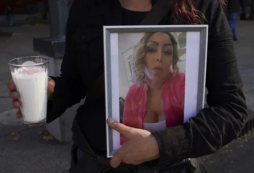 A protester holds a portrait of Trans activist Samantha Gomes Fonseca at a rally in Mexico City – Photo by Marco Ugarte / AP