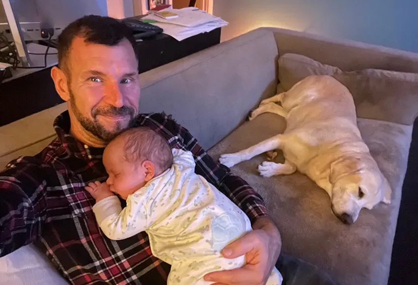 The devoted Dad with his son and the family dog Oke enjoy much deserved, and rather rare, quiet time – Courtesy photo