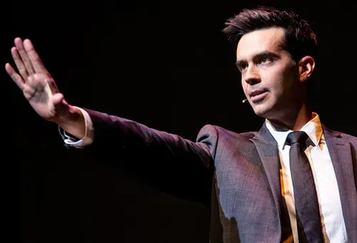 Rainbow magic: Magician Michael Carbonaros Lies on Stage coming to the Neptune Theater