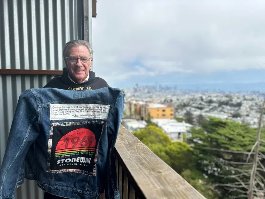 San Francisco publicist Lee Houskeeper shows the jacket he had made commemorating the help he gave to LGBTQ protesters during the 1969 Stonewall riots in New York City. Photo: John Ferrannini