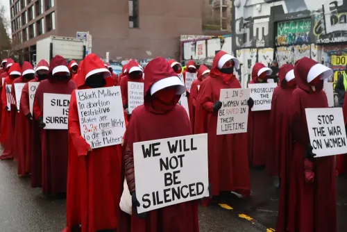 Hundreds of soaked supporters gather for the Seattle Womens March during International Women’s Day