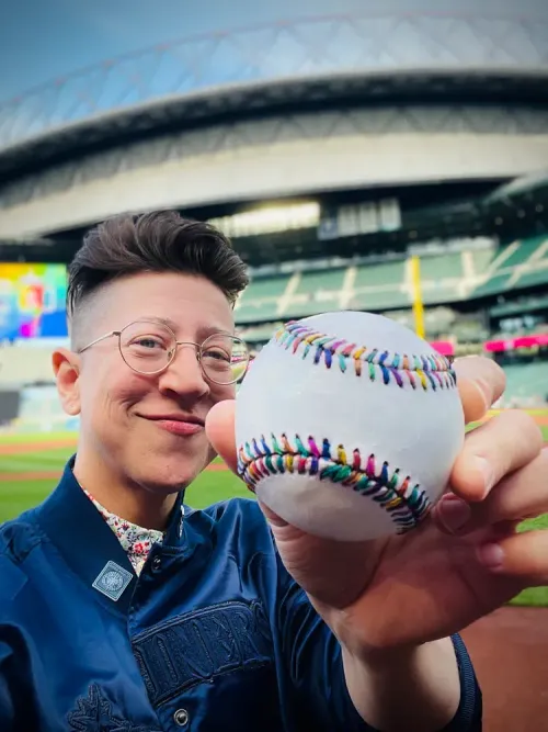 Mariners introduce new Pride tradition: A traveling rainbow baseball